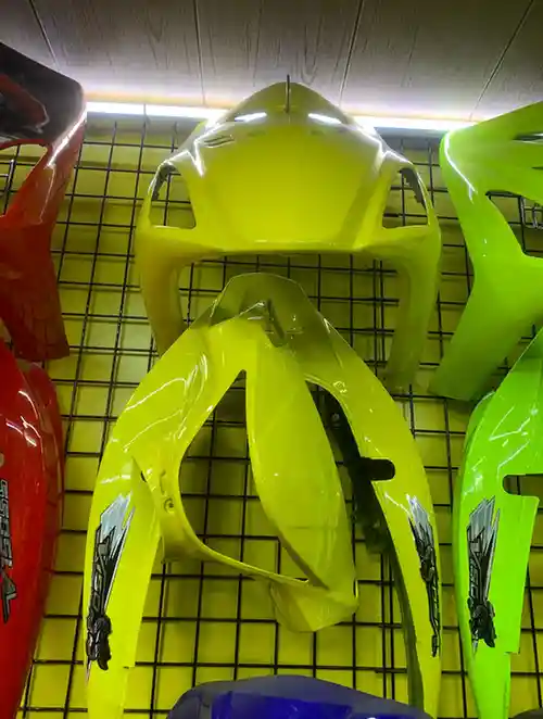 v150 هيكل خارجي - الهيكل والإطار - عادي – هيكل خارجي انسيابي يُركب على الدراجة النارية لتقليل مقاومة الهواء وحماية السائق...